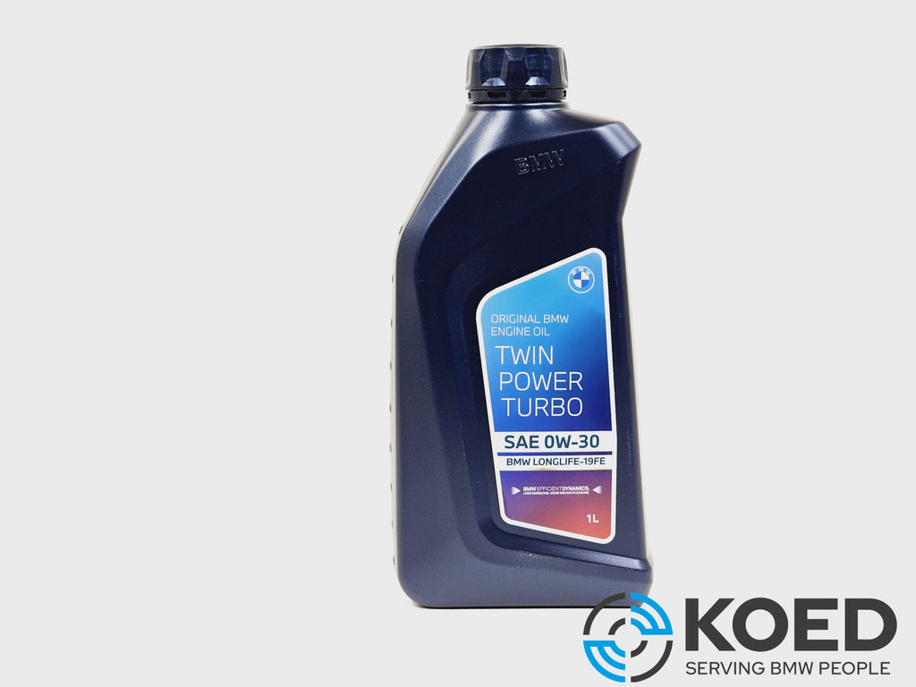A 1-liter bottle of BMW Twin Power Turbo SAE 0W-30 engine oil, shown on a light gray background with a KOED logo in the bottom right corner.